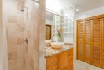 Gold remodeled guest bath-shower, granite counter, custom sink, washer/dryer and toilet